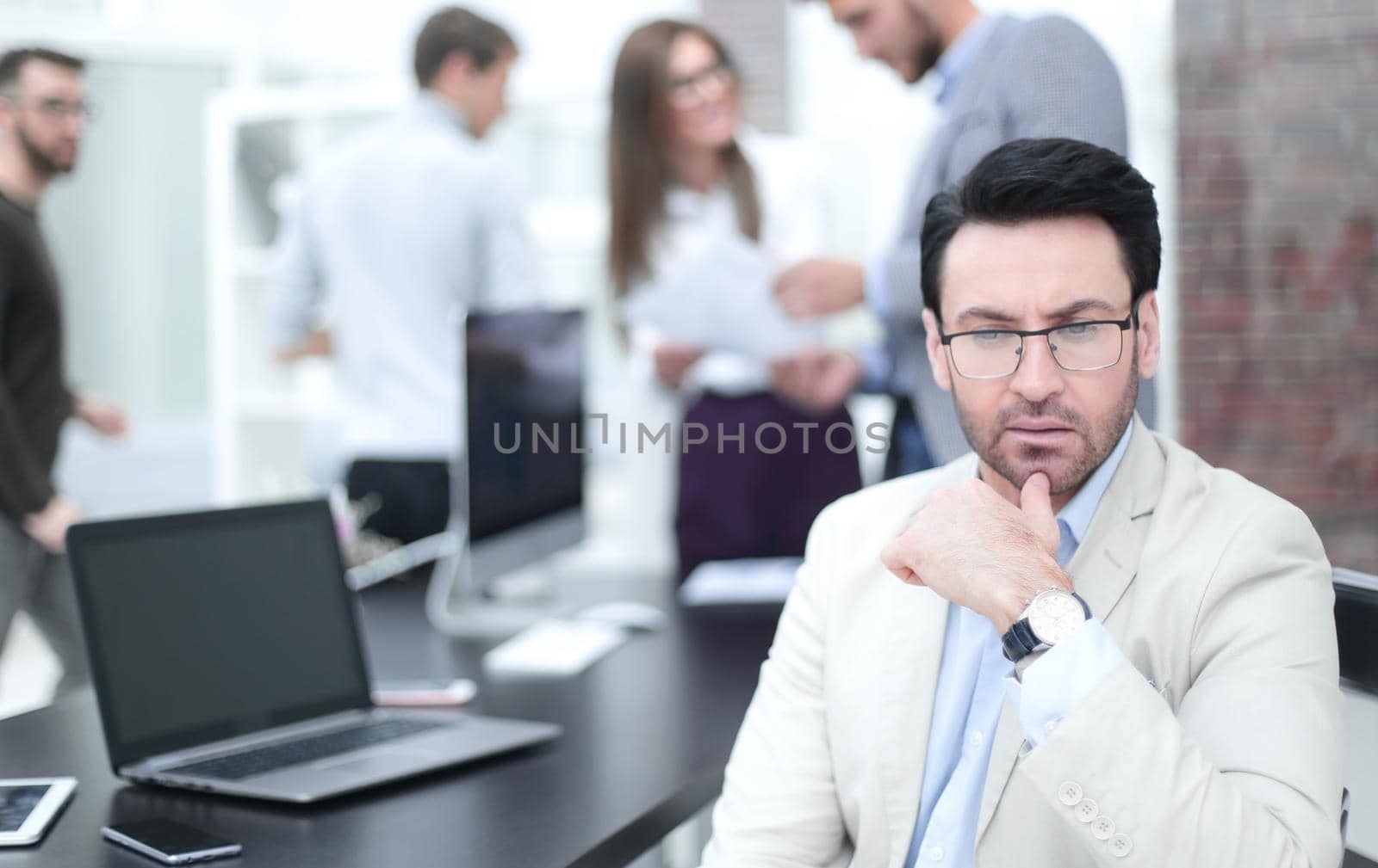 serious businessman in the background of the office.photo with copy space