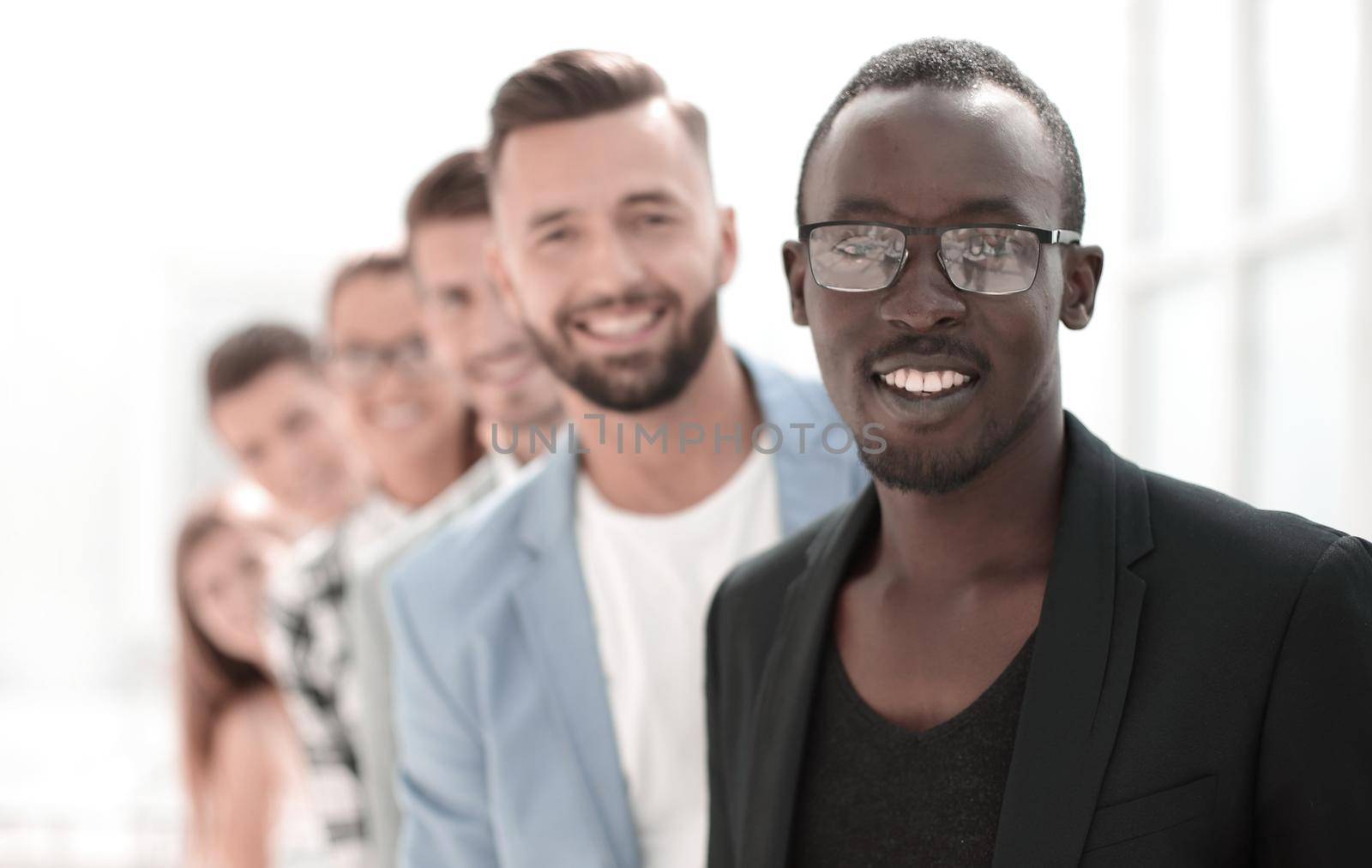 Diverse group of people standing in row. Isolated on white