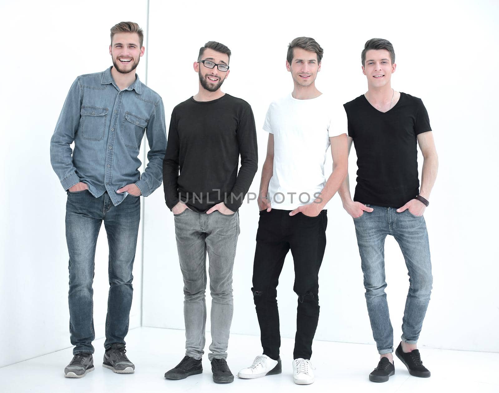 in full growth. a group of modern young men .isolated on white