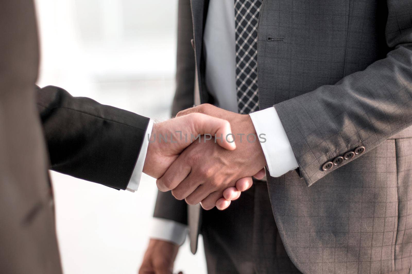 close up. handshake business partners .the concept of cooperation