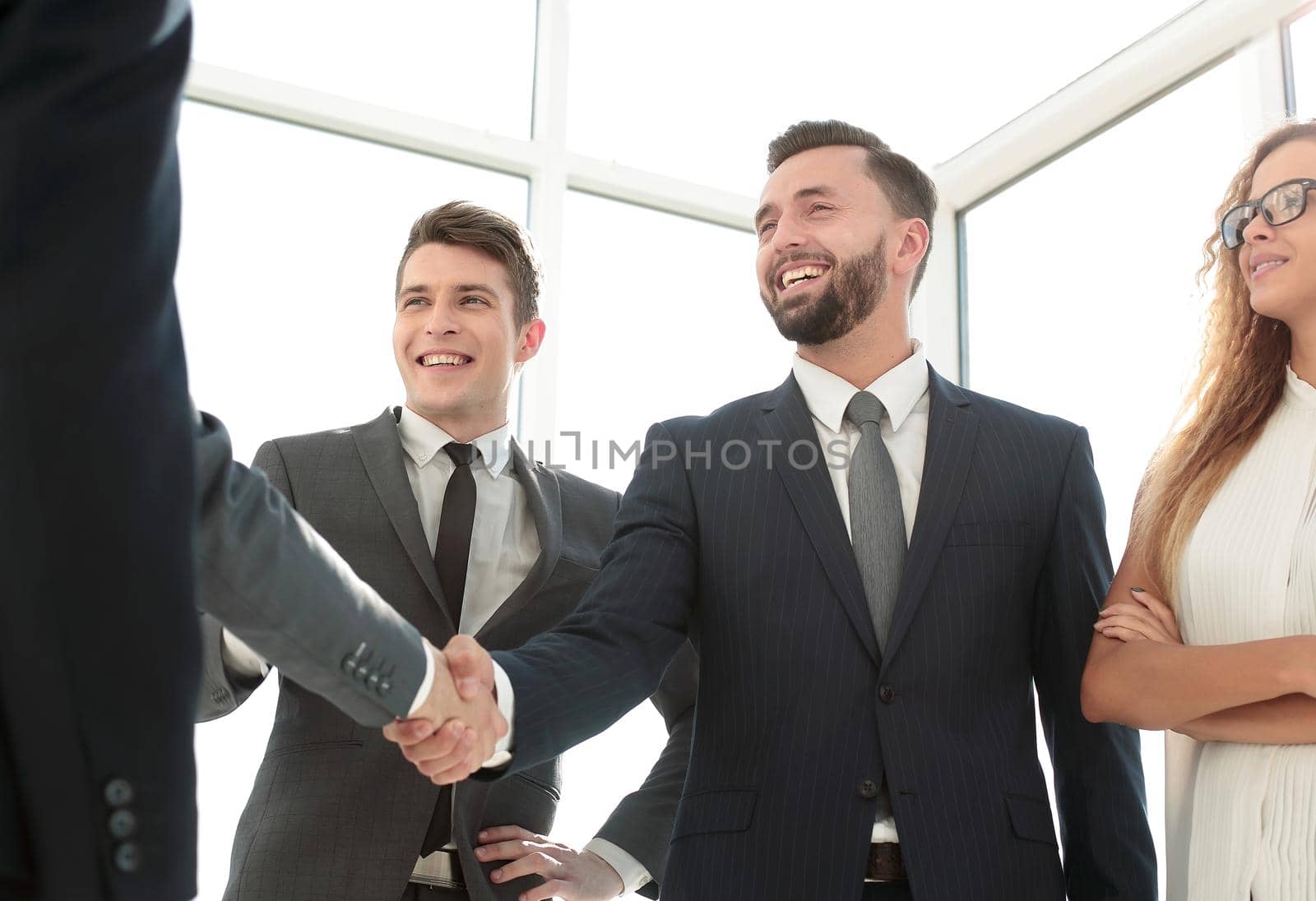 handshake of young business partners in the office.concept of cooperation