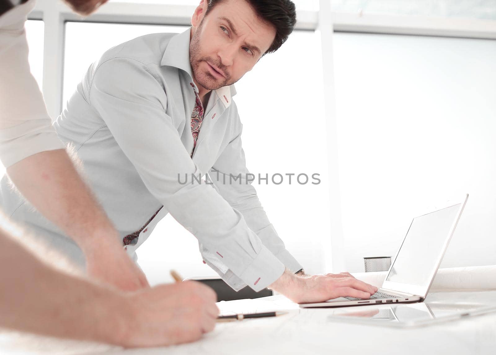 two architects use a laptop for work. photo with copy space