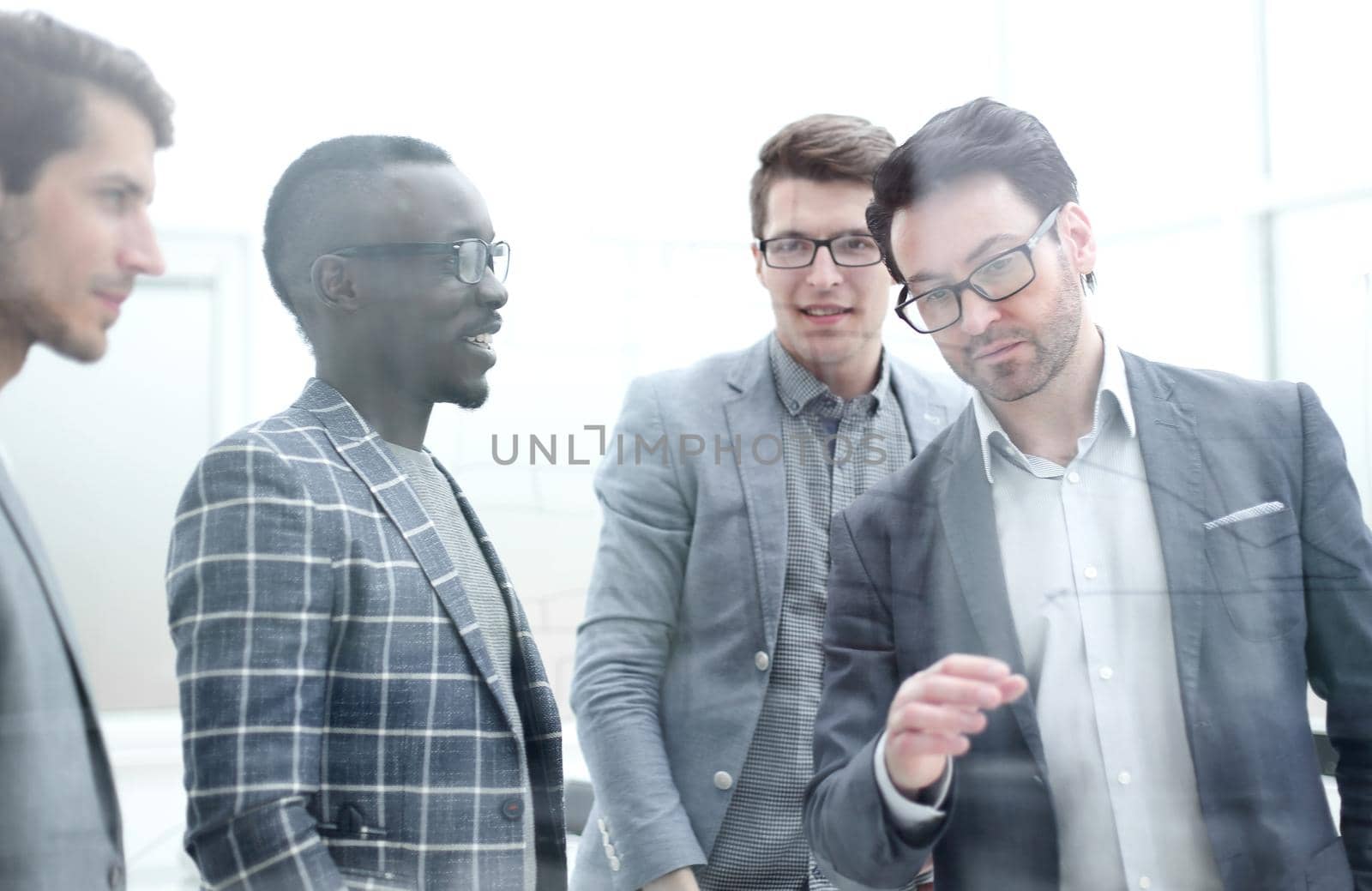 businessman discussing with the business team a new strategy of the company. business concept