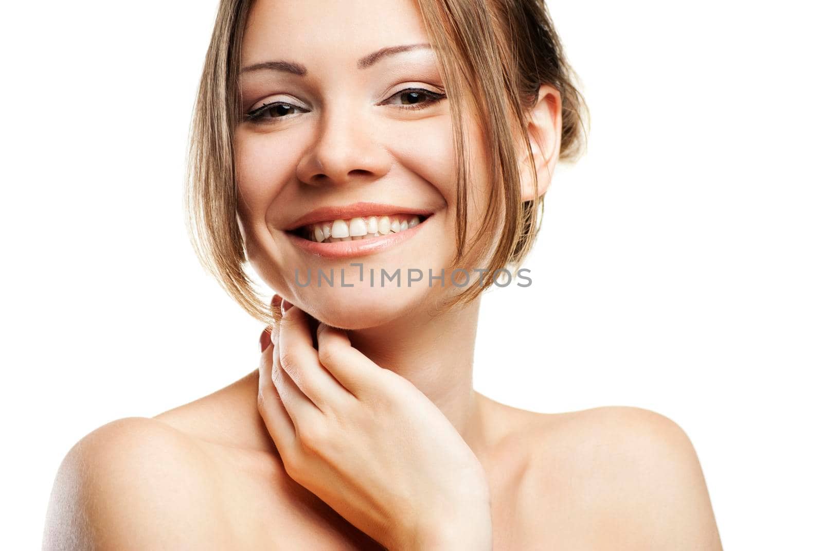 Beautiful woman's face with clean skin on white by Julenochek