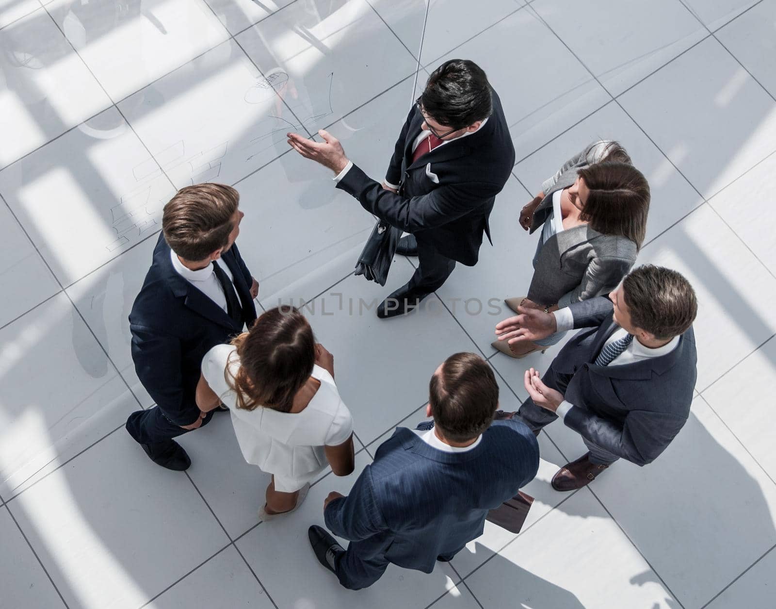 top view. employees standing in a modern office. photo with text space