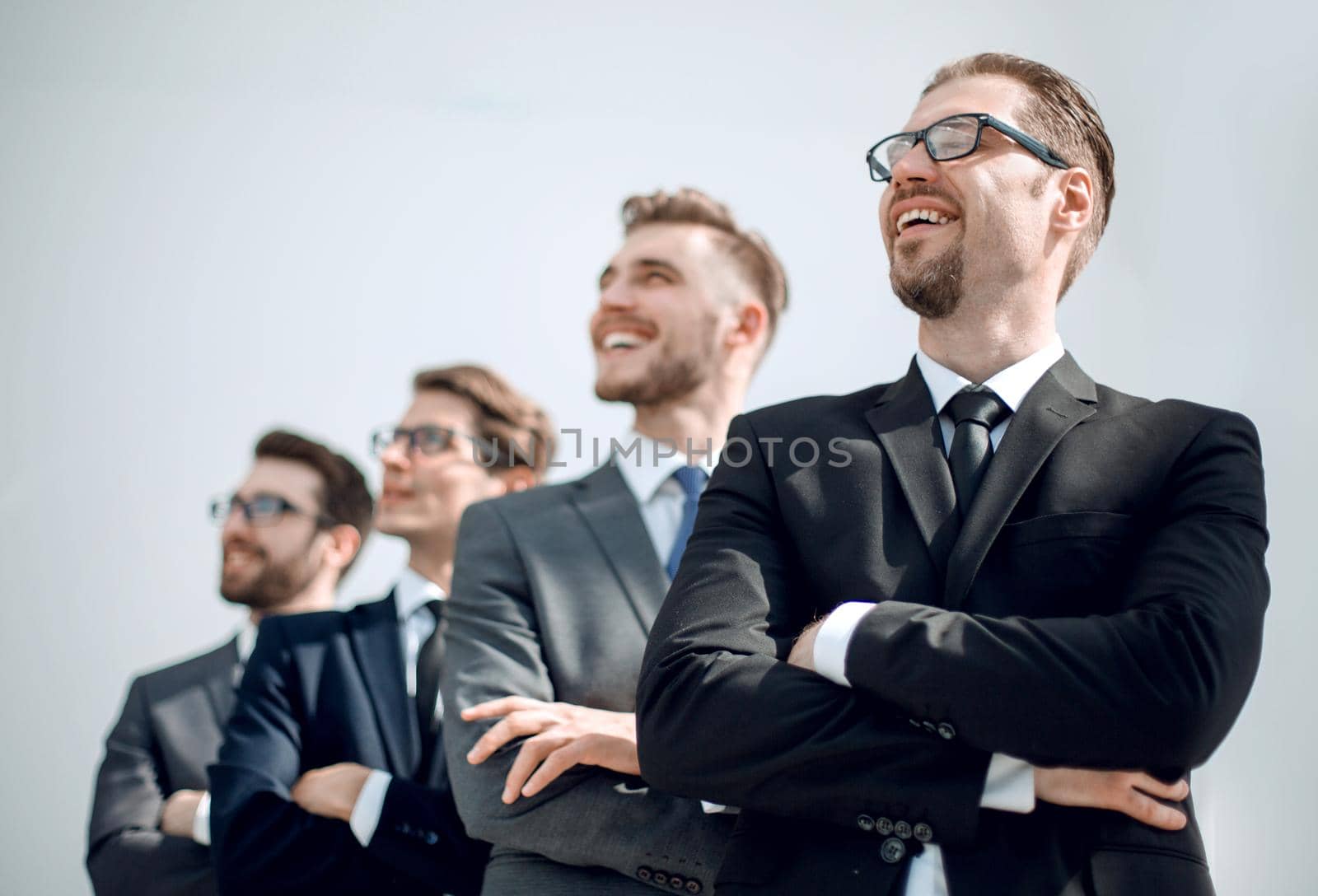 group of business people standing in a row and looking at a copy space.business concept
