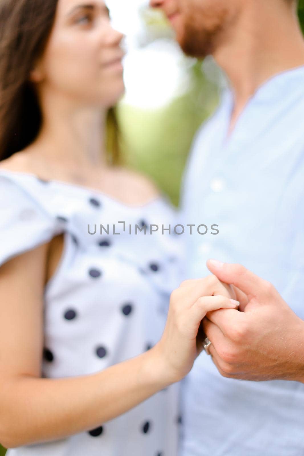 Man holding wife hand and dancing. by sisterspro