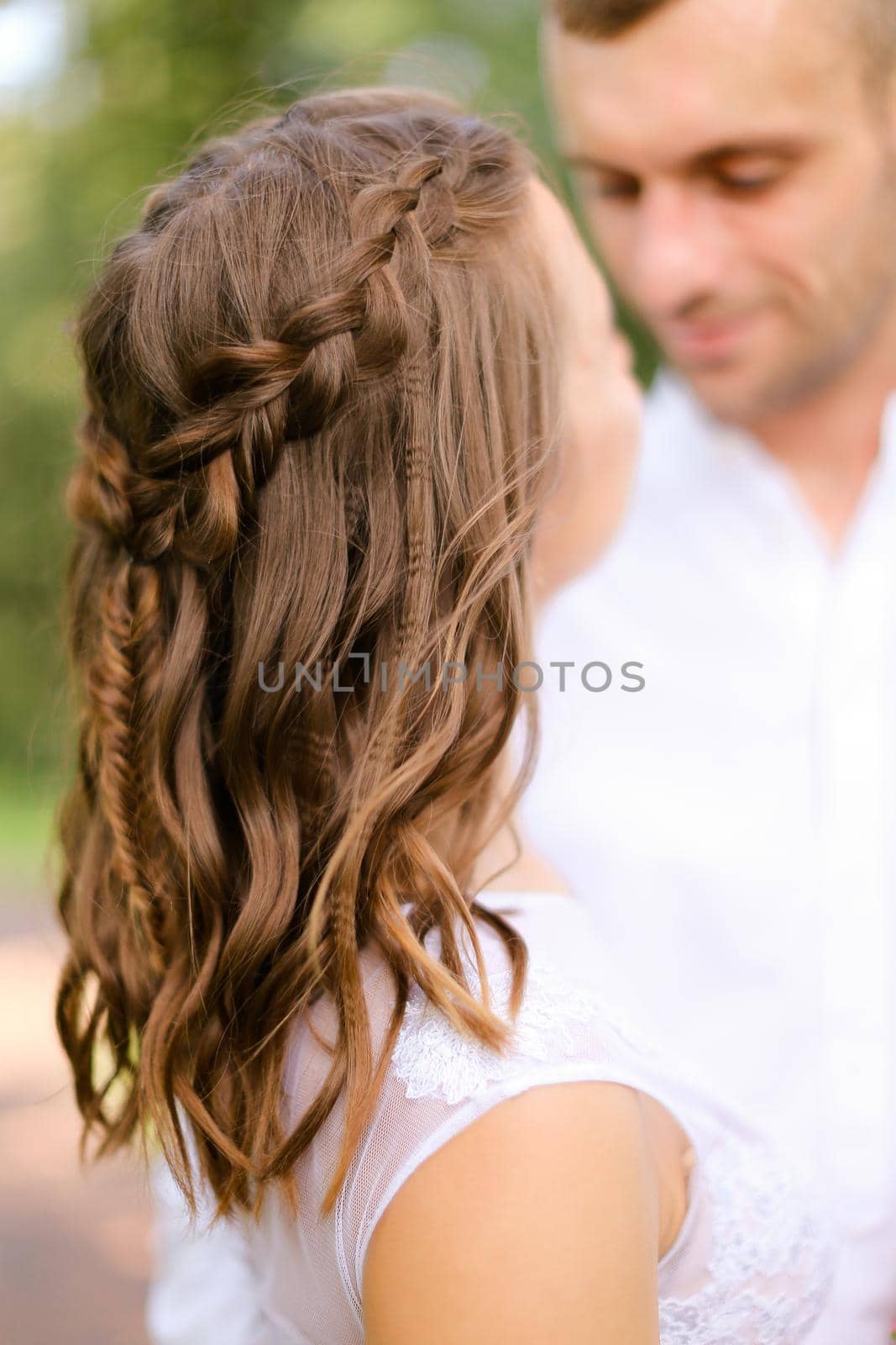 Happy groom with caucasian fiancee. Concept of married couple and love.