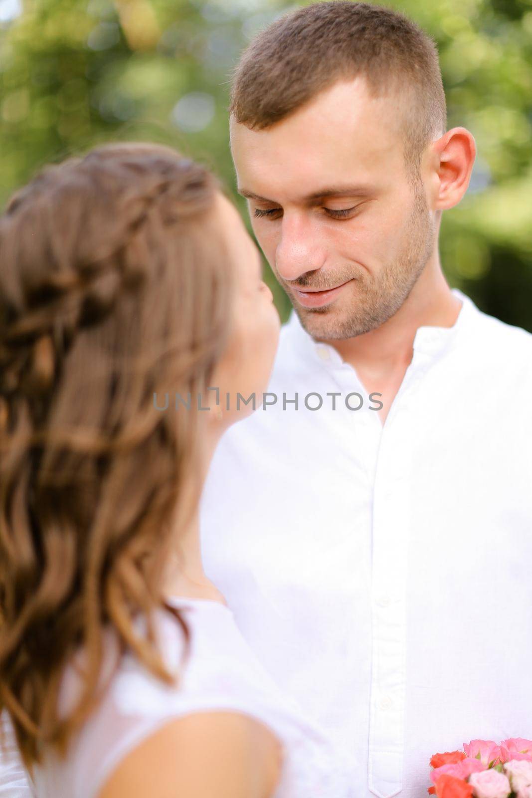 Happy groom in white shirt with caucasian bride. by sisterspro