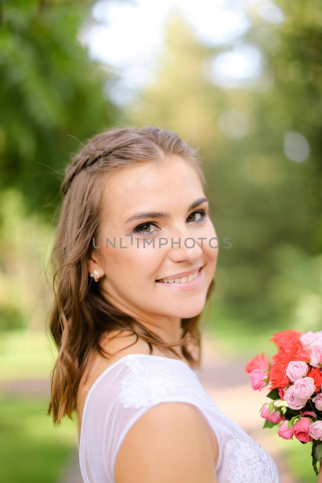 Happy smiling bride with bouquet of flowers. by sisterspro