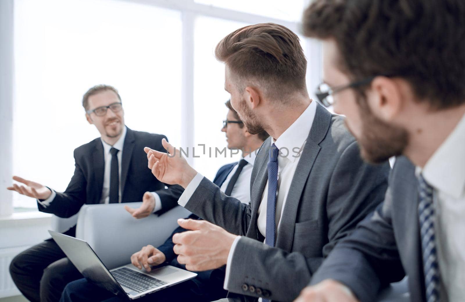 business colleagues sitting in the office waiting room .business concept