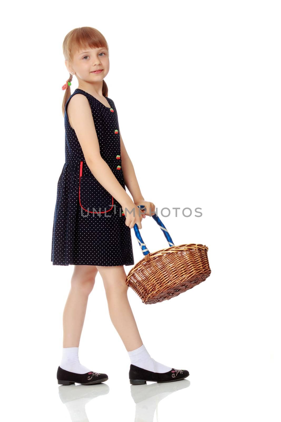 A little girl with a wicker basket made of willow twigs. The concept of family rest, harvesting, picking mushrooms and berries. Isolated over white background