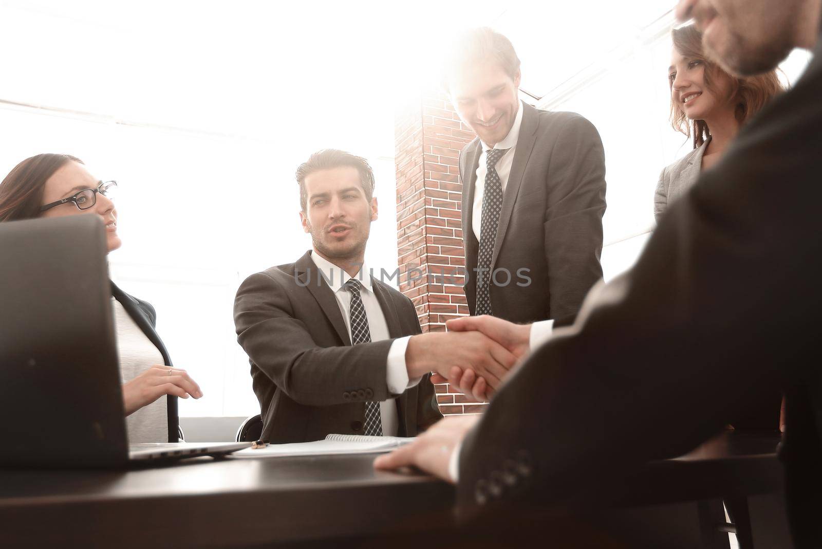 Business people shaking hands, finishing up a meeting