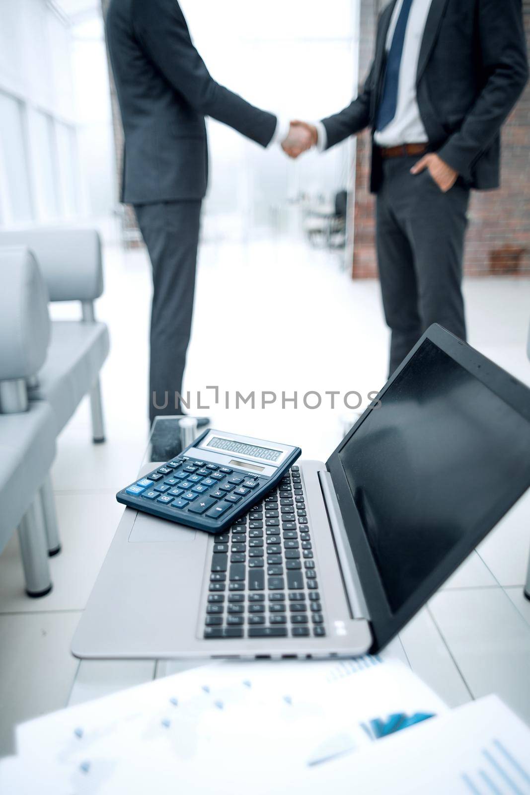 laptop and calculator on the desktop in the office.business concept