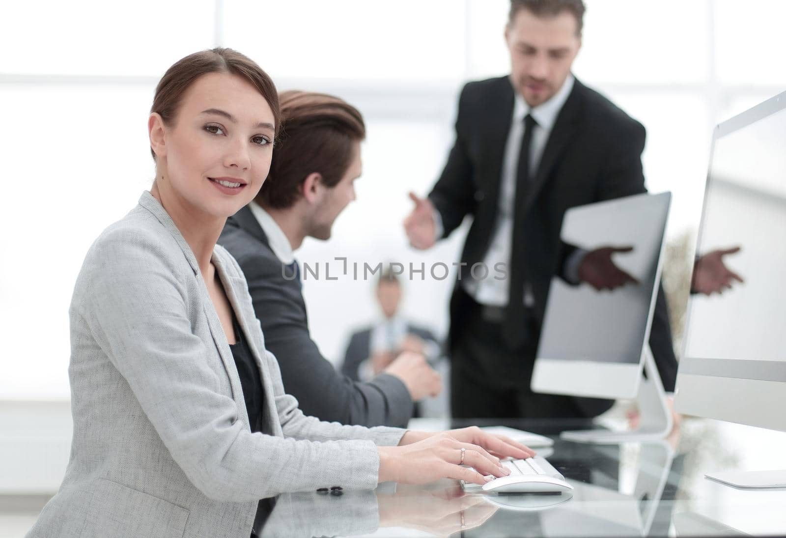 young employee sitting at his Desk.the concept of teamwork