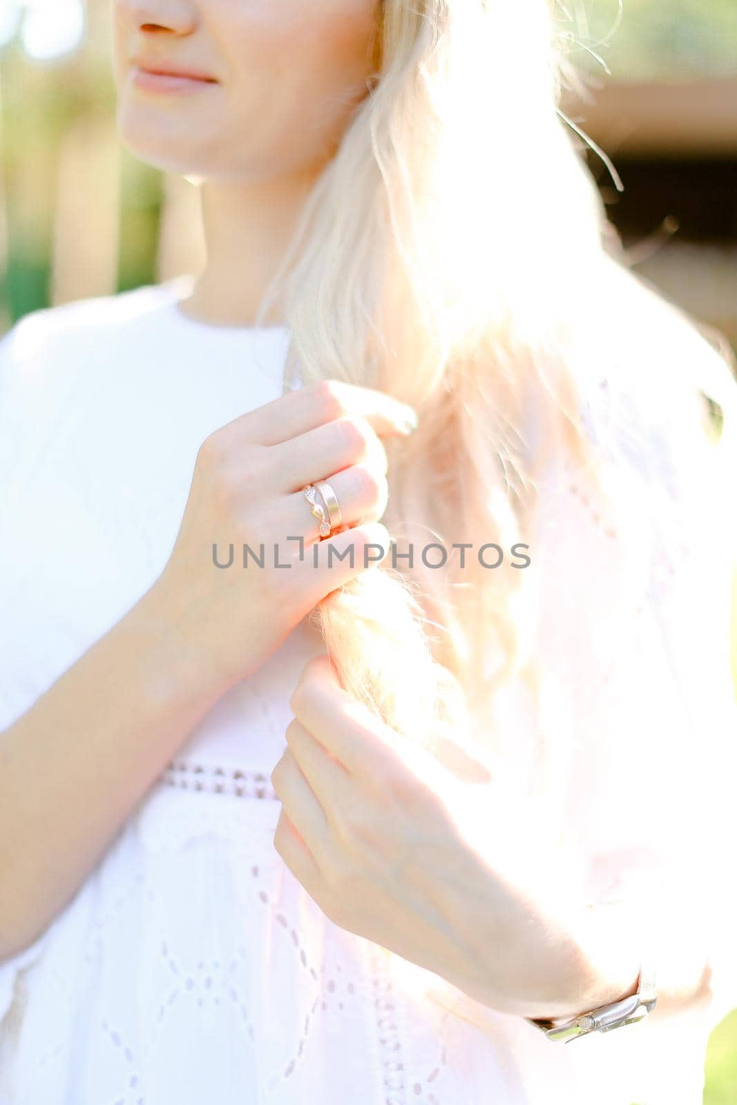 Blonde woman with gold rings on right hand. by sisterspro