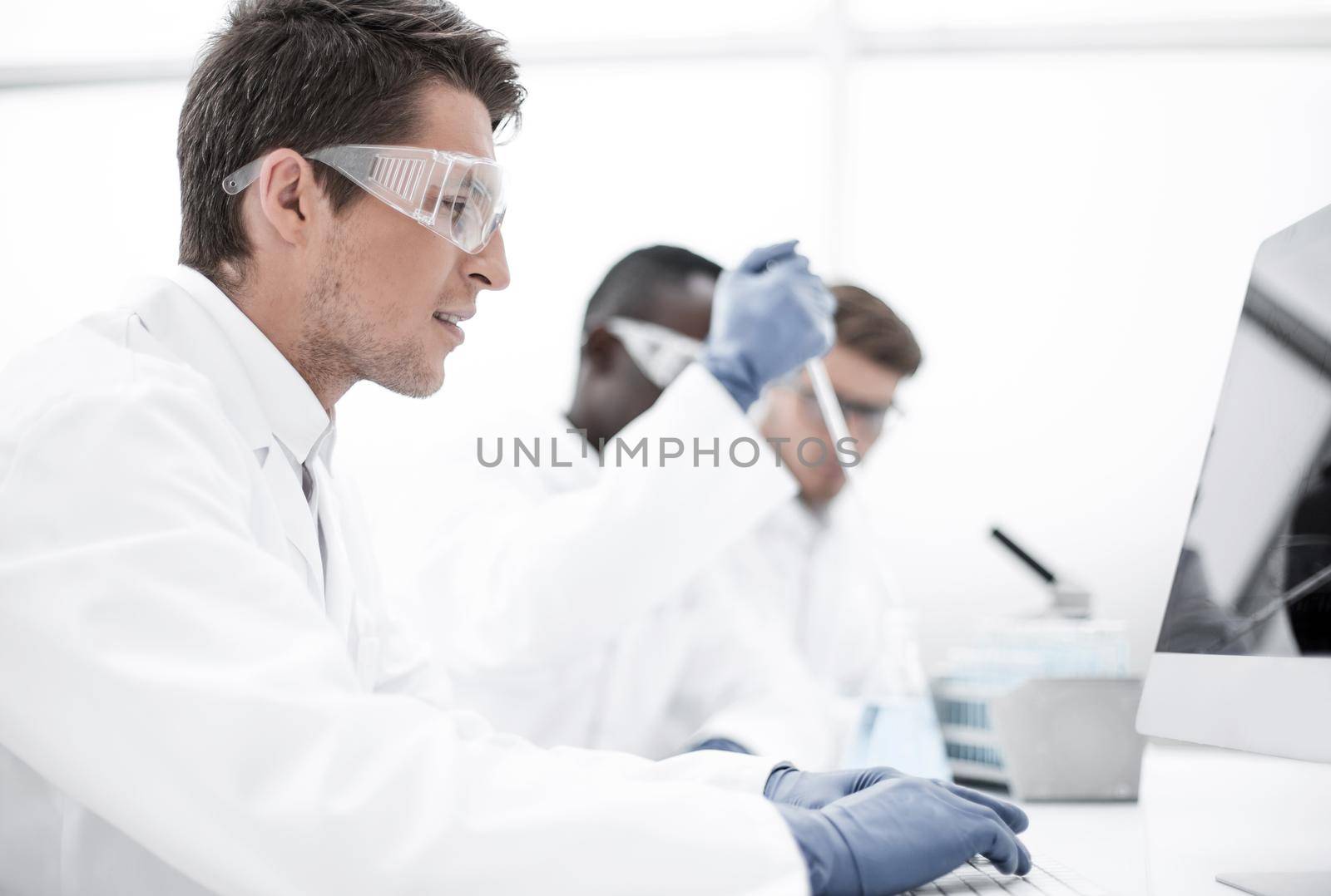 group of scientists conduct research in the laboratory. photo with copy space