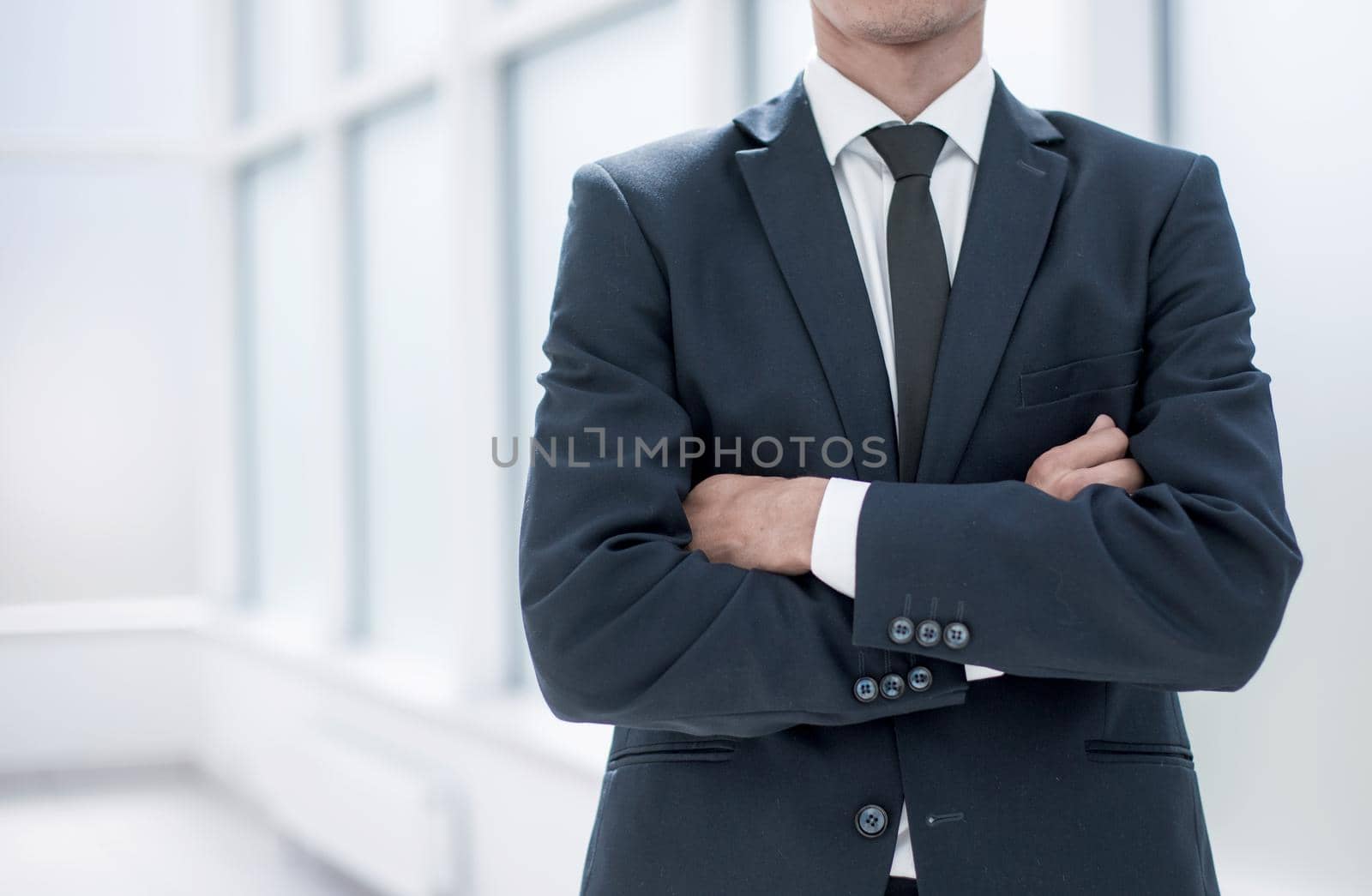 close up.confident businessman standing in the office.business concept