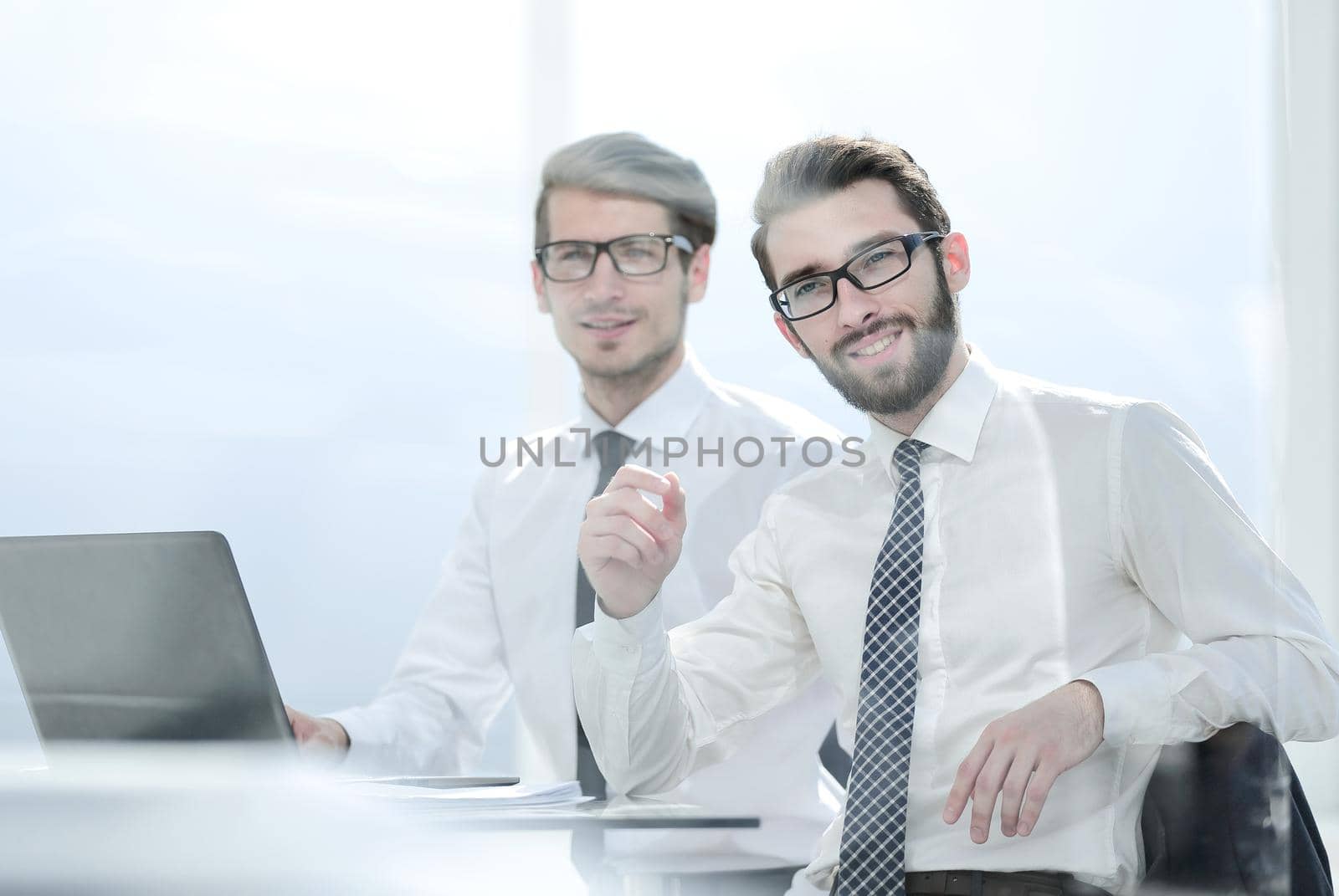 two business people sitting at the office Desk.photo with copy space