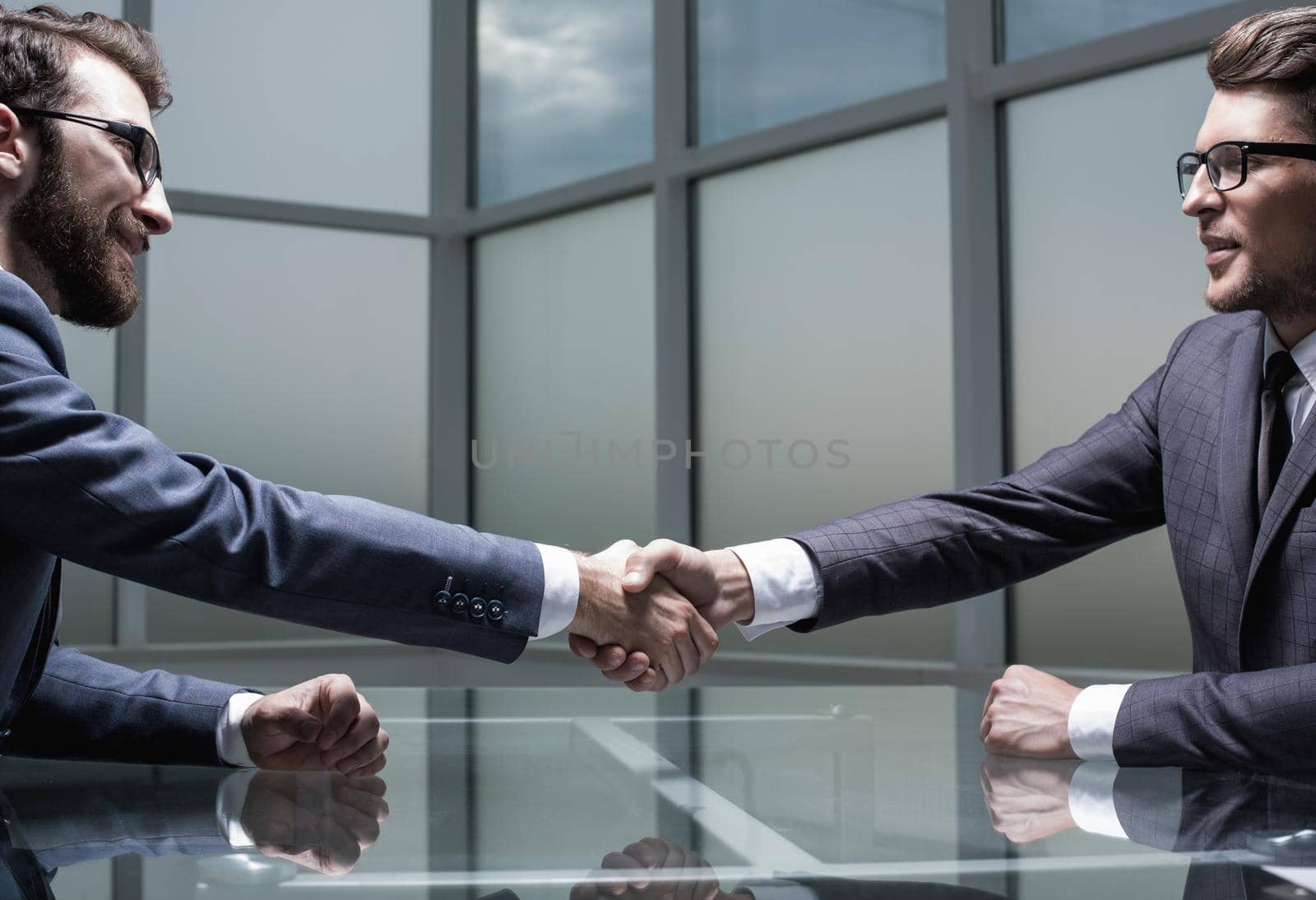 close up.business handshake over the Desk.photo with copy space