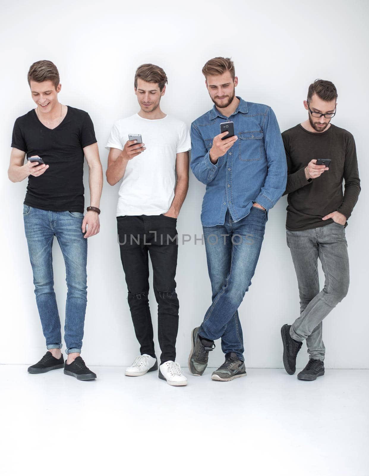 in full growth.group of friends with smartphones by asdf