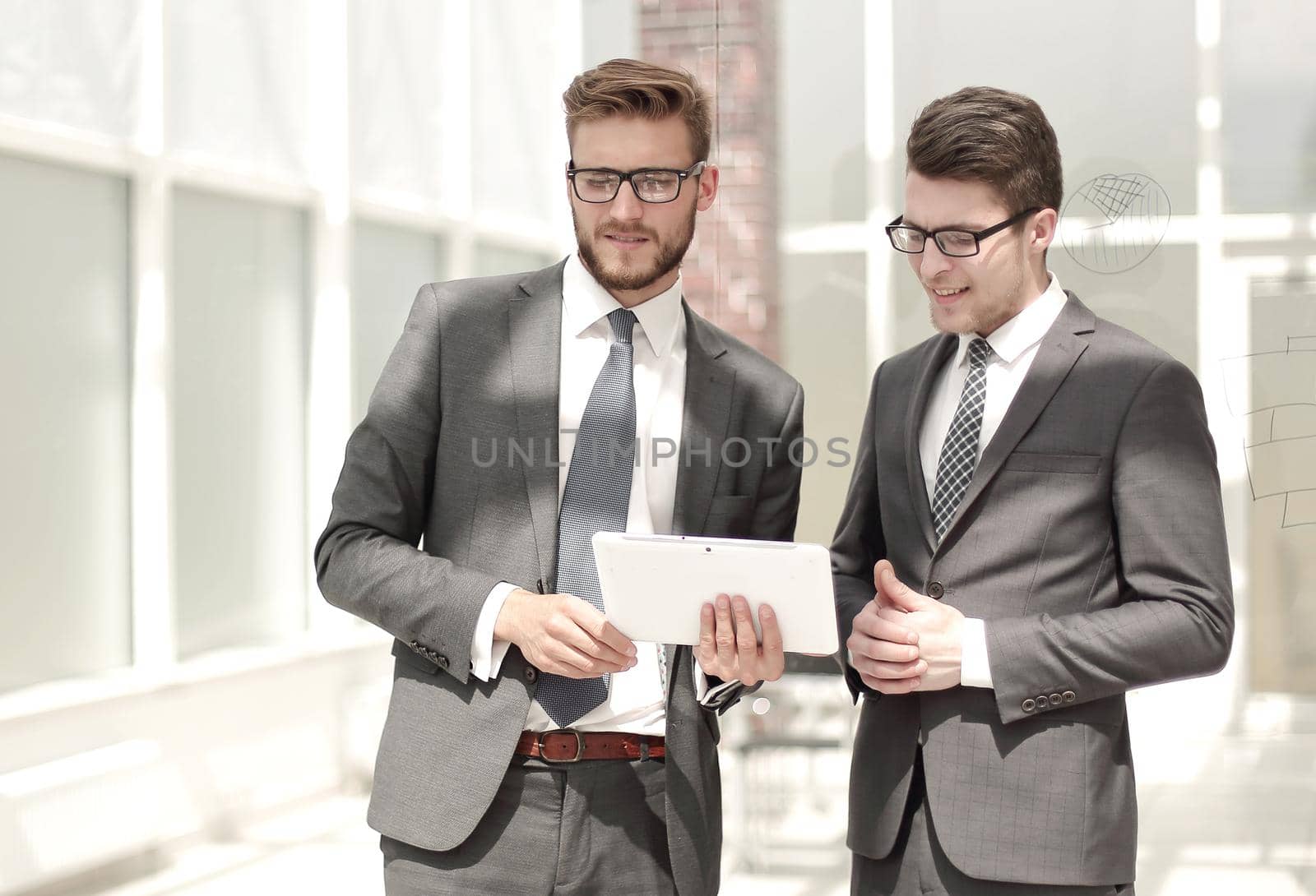 two employees standing in the office . photo with copy space