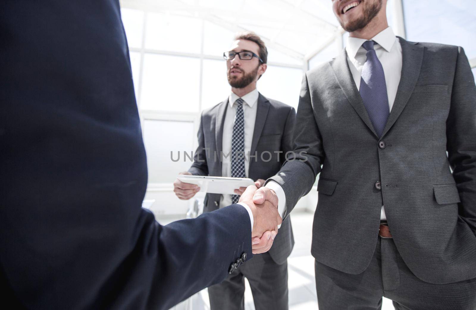 welcome and handshake of business partners . business concept
