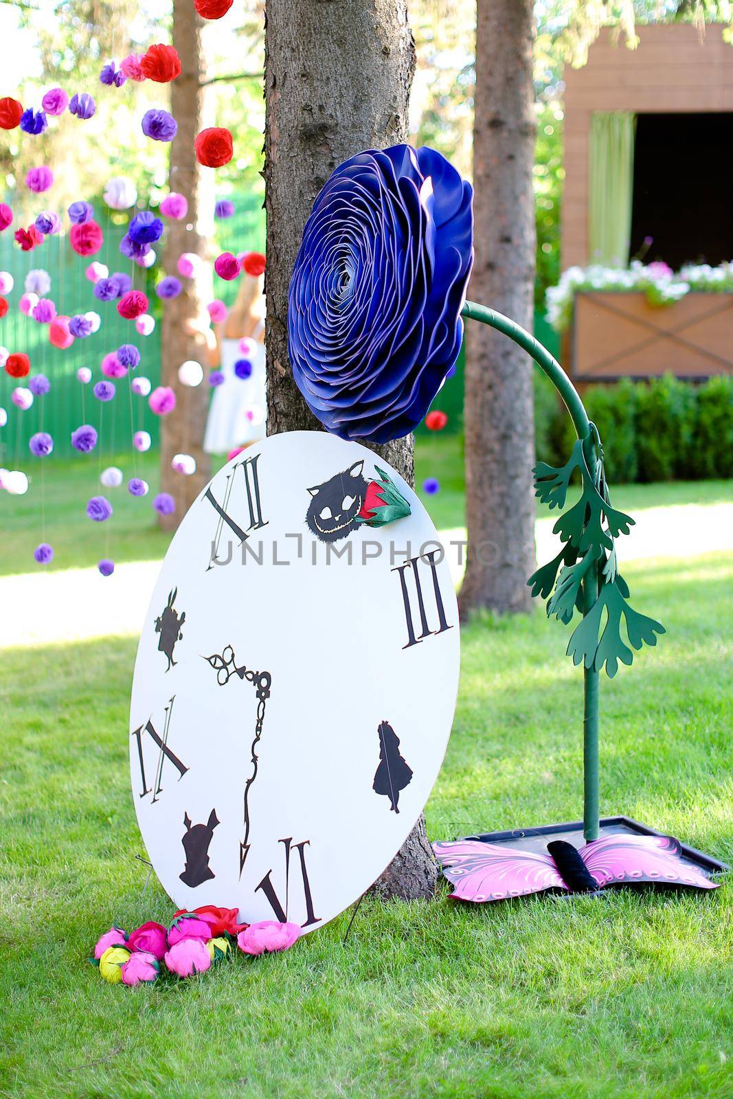 Clock and flowers as bright festive decorations for summer camp.