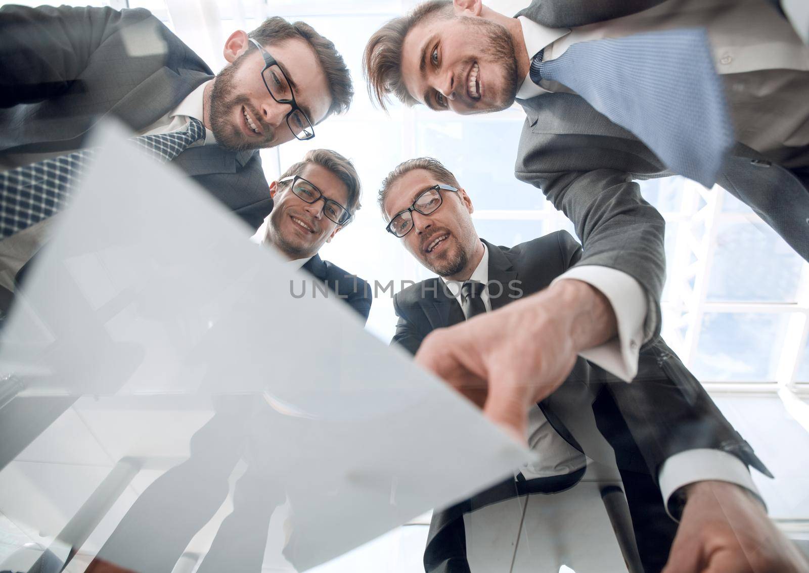 bottom view.business team discussing the terms of the contract .business concept