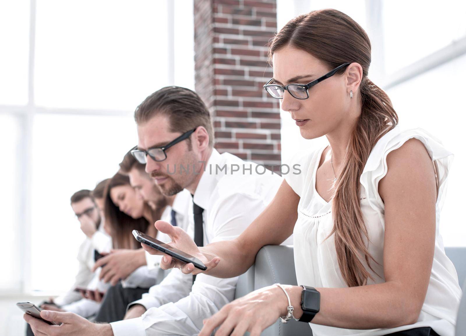 young woman sitting in line for an interview by asdf