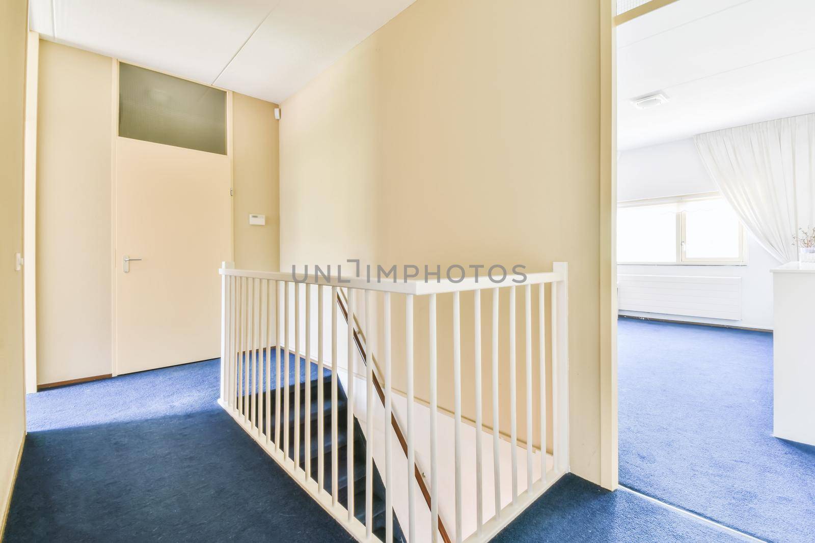 A room with a staircase by casamedia
