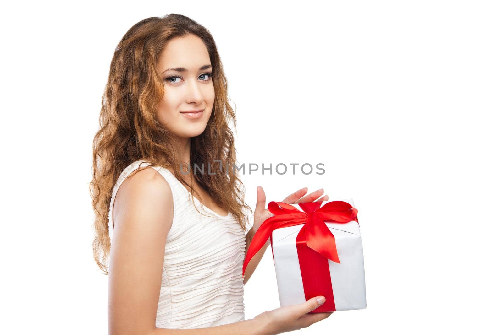 Beautiful young Christmas girl with a present isolated on white background