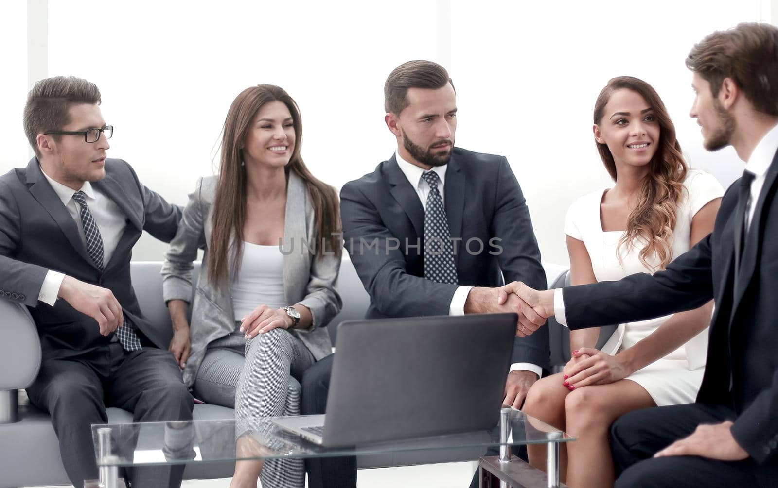 business partners shaking hands during negotiations. the concept of cooperation
