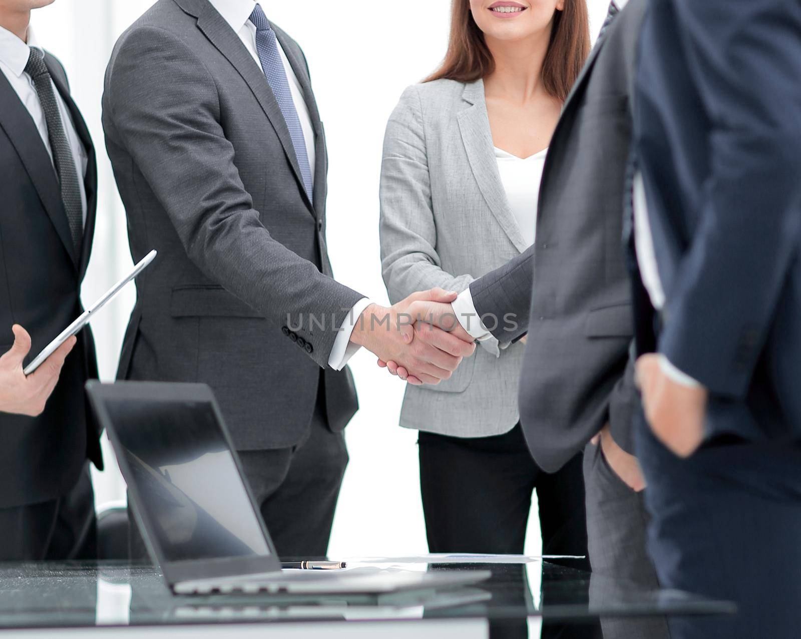 business team and handshake of business partners.