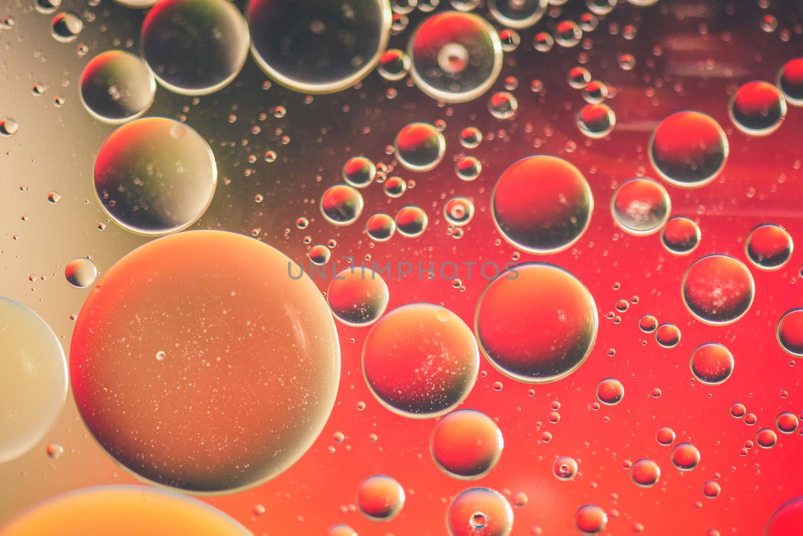 Red abstract background picture made with oil, water and soap by anytka