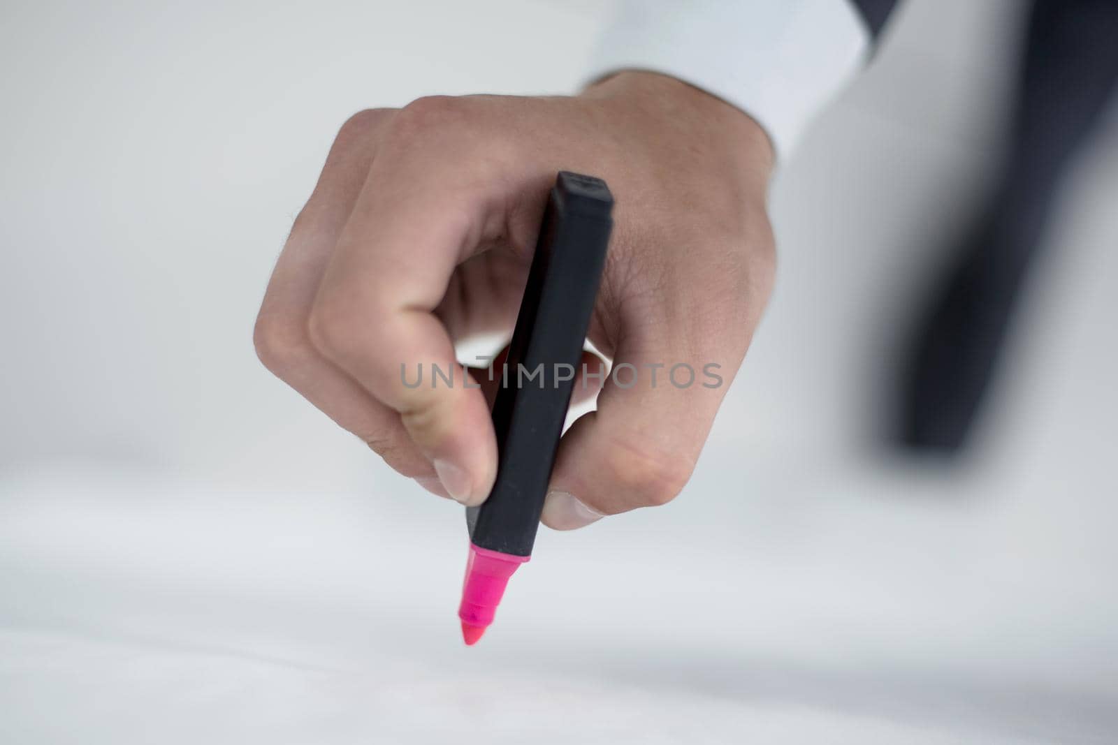 close up.businessman draws a marker on the flipchart.business concept