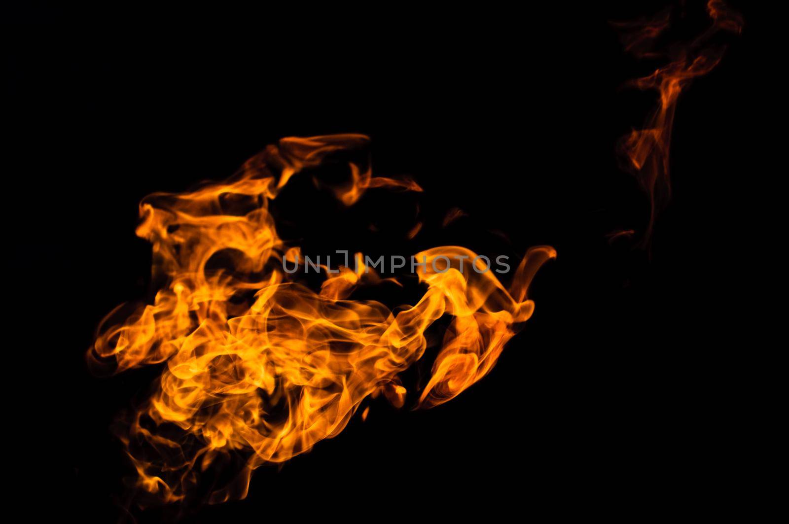tongue of the flame over black background