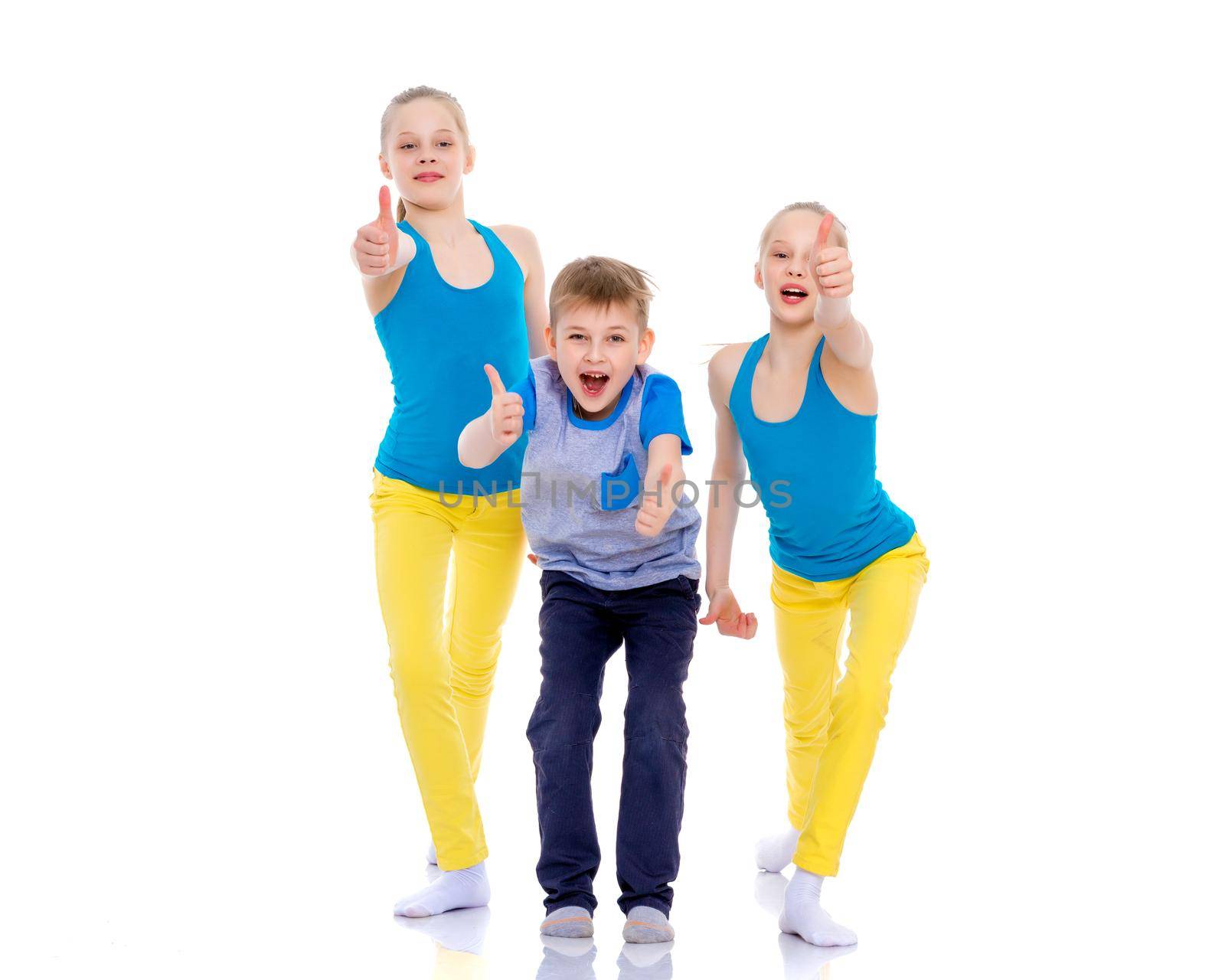 A group of cheerful, emotional children keep their thumbs up. The concept of advertising, sports and fitness. Isolated on white background.