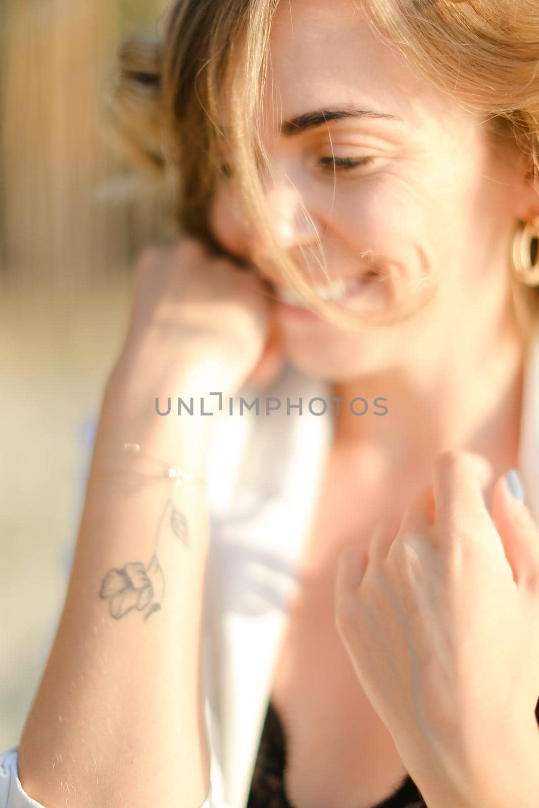 Portraint of young cute woman with little hand tattoo. by sisterspro