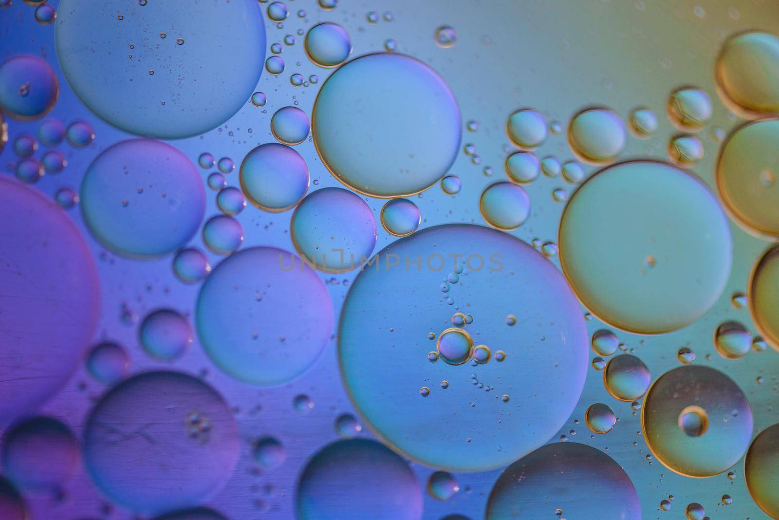 Oil drops in water. Abstract psychedelic pattern image multicolored. Abstract background with colorful gradient colors. Dof.