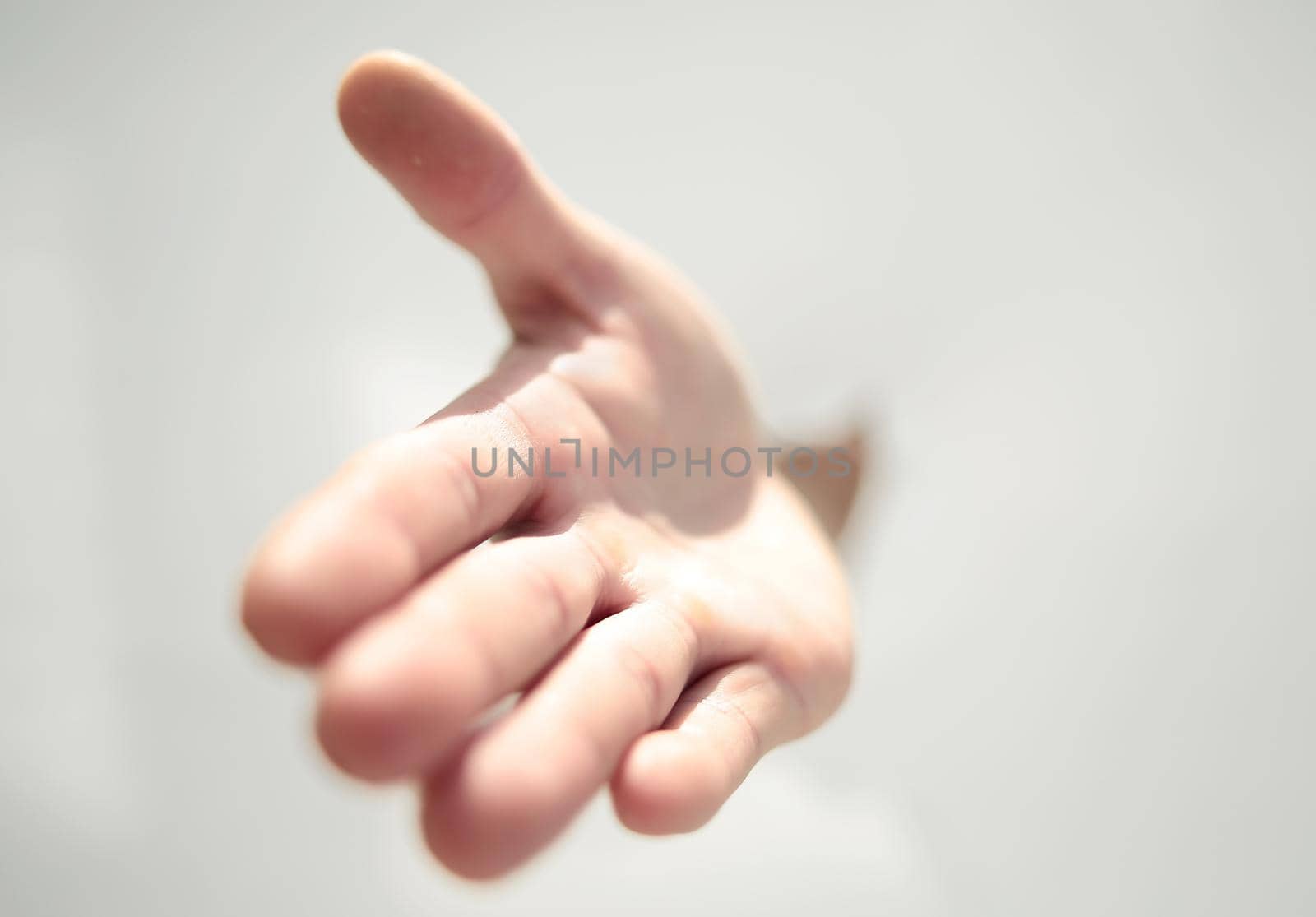 close up.a man's hand breaking through the paper wall .photo with copy space