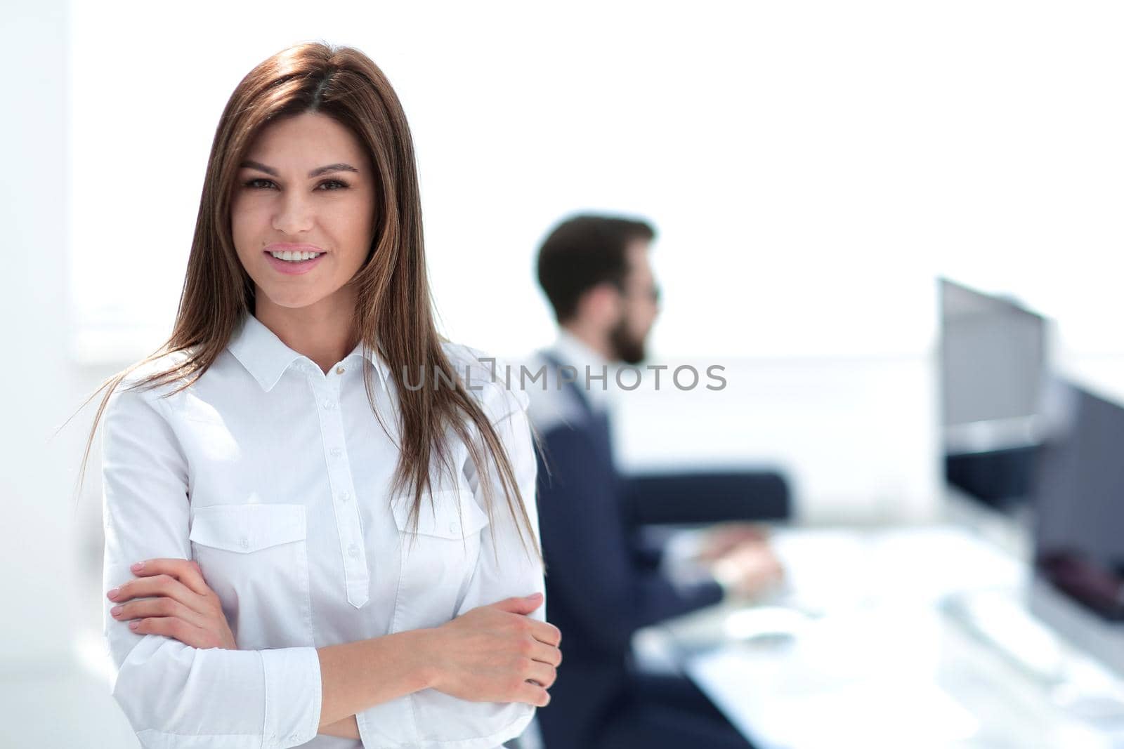 smiling business woman on the background of the workplace. photo with copy space