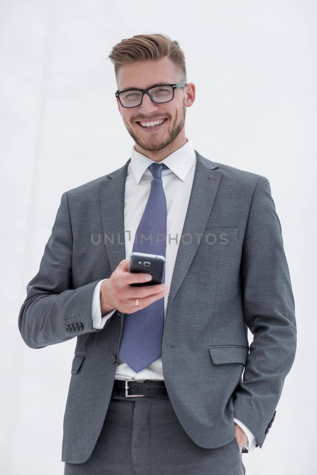 successful businessman with a smartphone.isolated on white