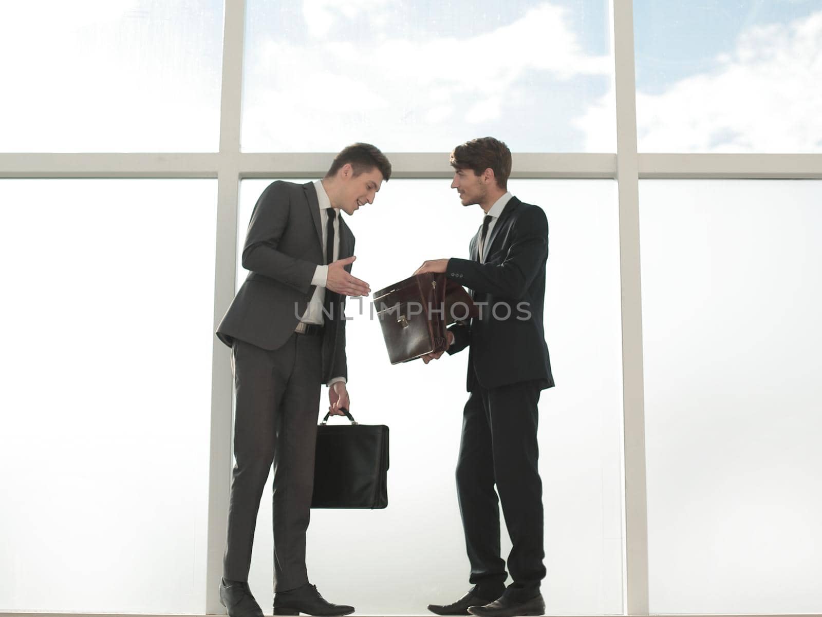 business colleagues showing each other business documents.photo with copy space