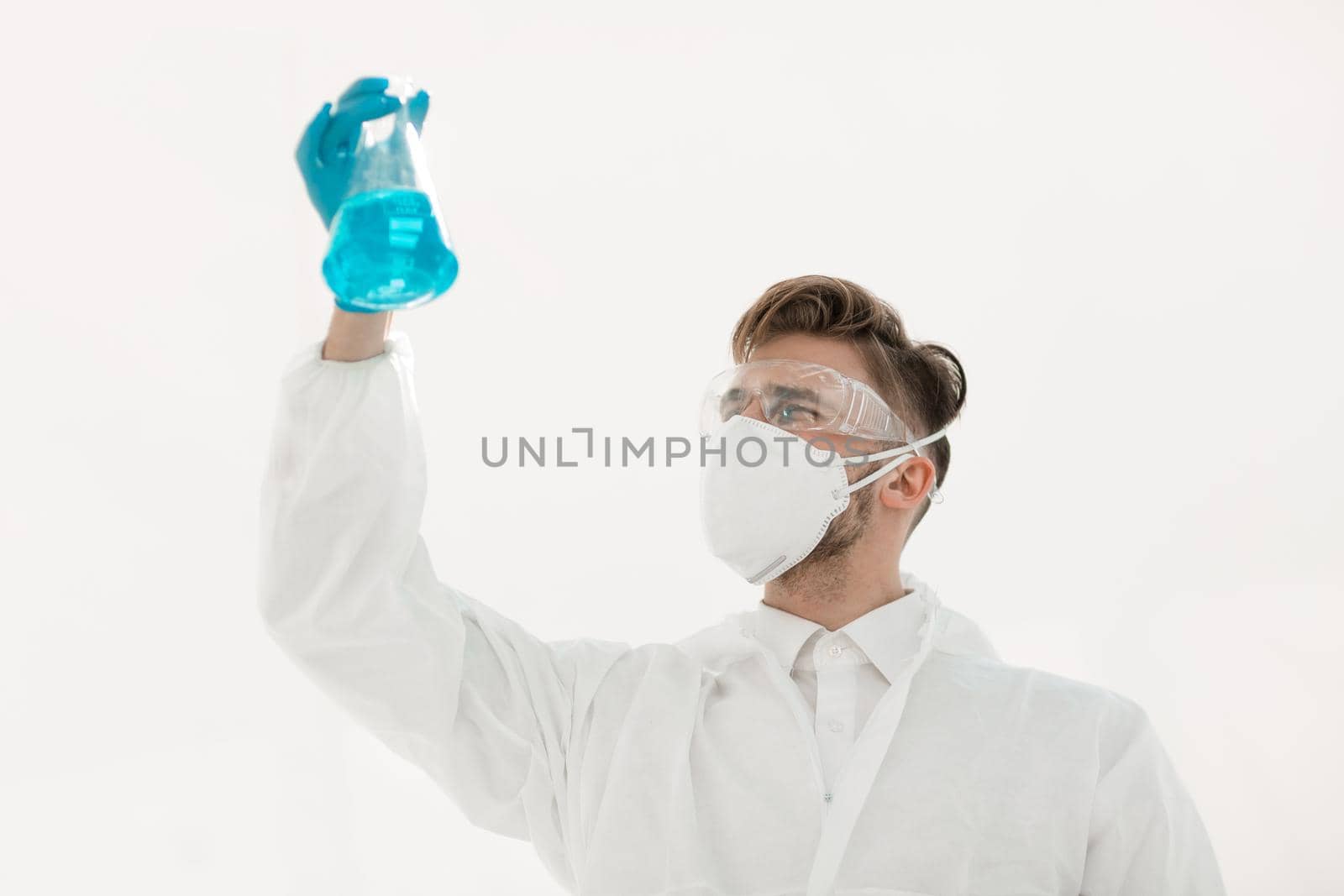 modern scientist examining the liquid in the flask.photo with copy space