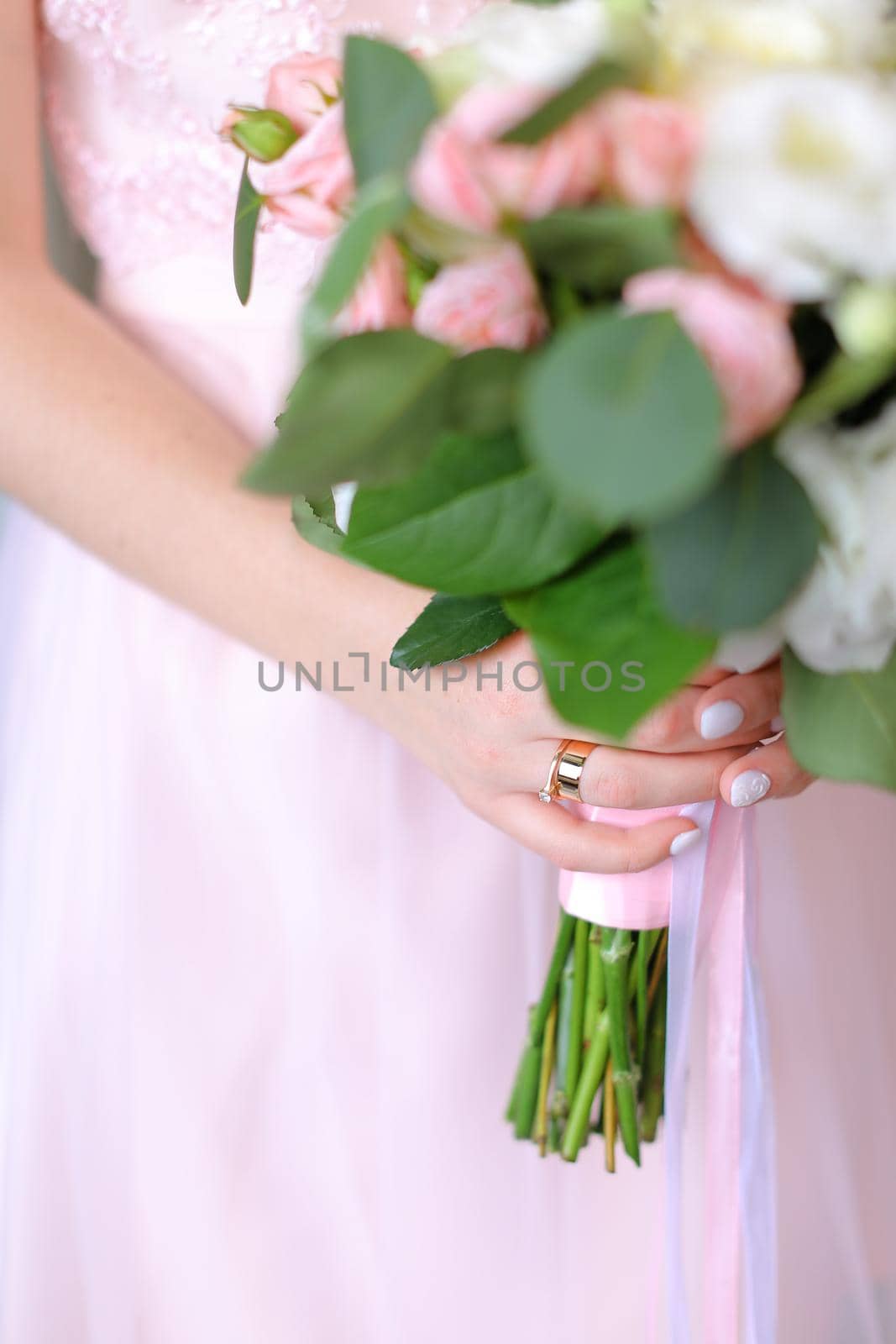 Close up nice bouquet of flowers in light pink dress background. by sisterspro