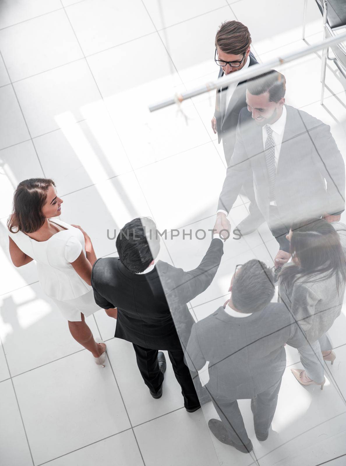 business background.handshake business men in the circle of employees. business concept