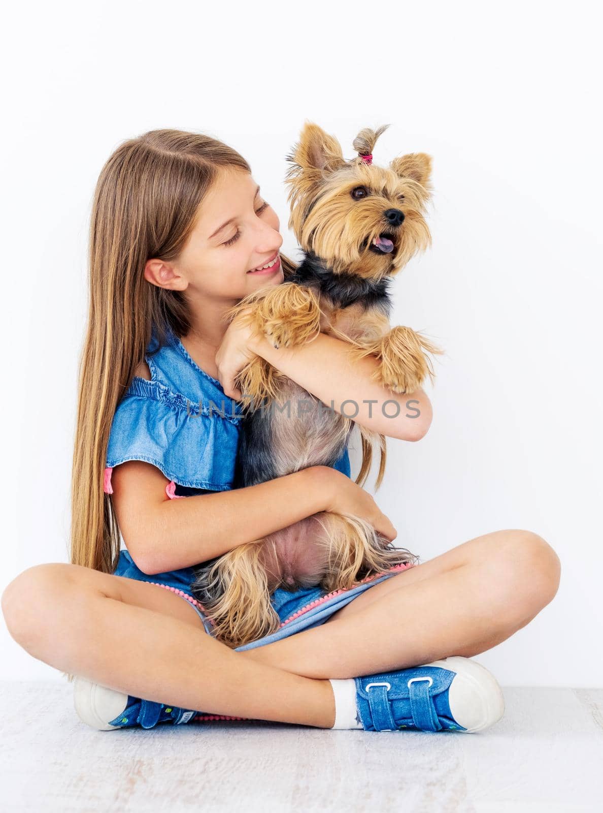 Sitting girl holds small dog by GekaSkr