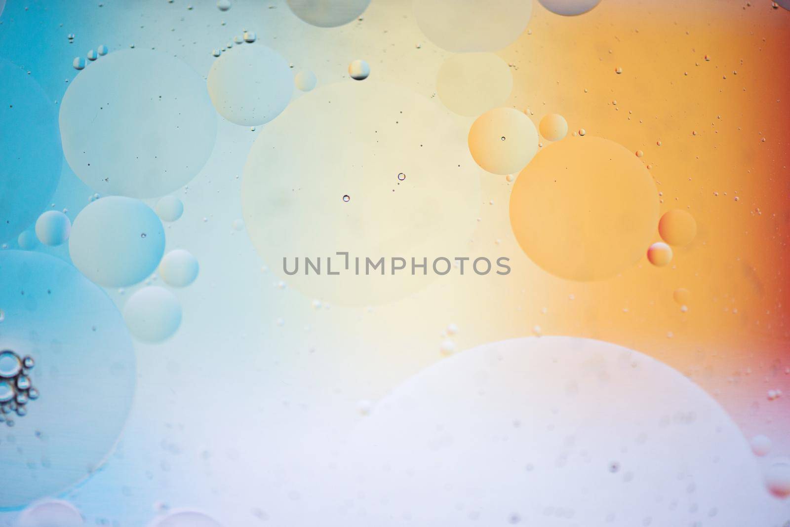 Oil drops in water. Abstract psychedelic pattern image rainbow colored. Abstract background with colorful gradient colors. DOF