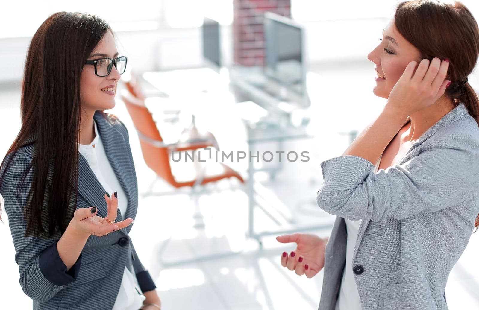 two employees talking standing in the office.office weekdays